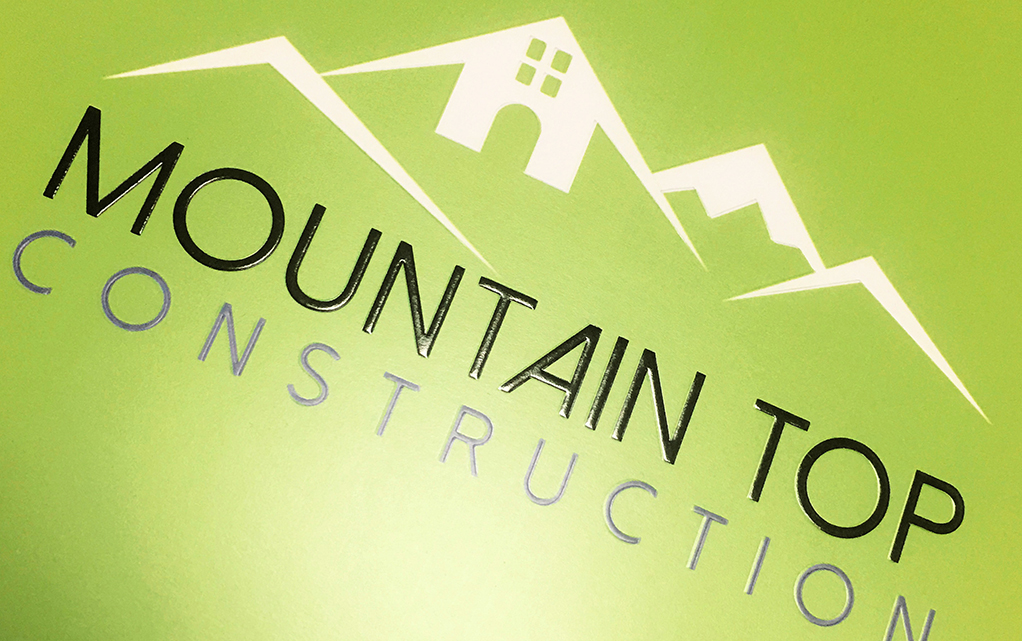 Detail of Mountain Top Contruction's folder deaturing both embossing and foil stamping (black foil)