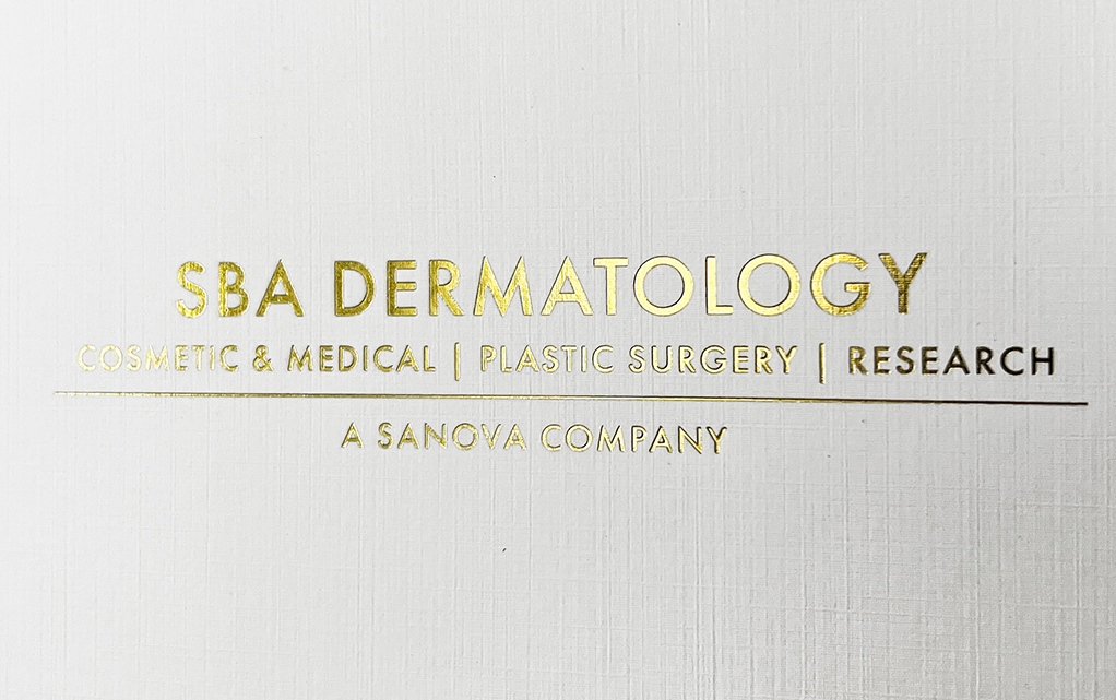 Detail of SBA Dermatology's folder deaturing gold foil stamping