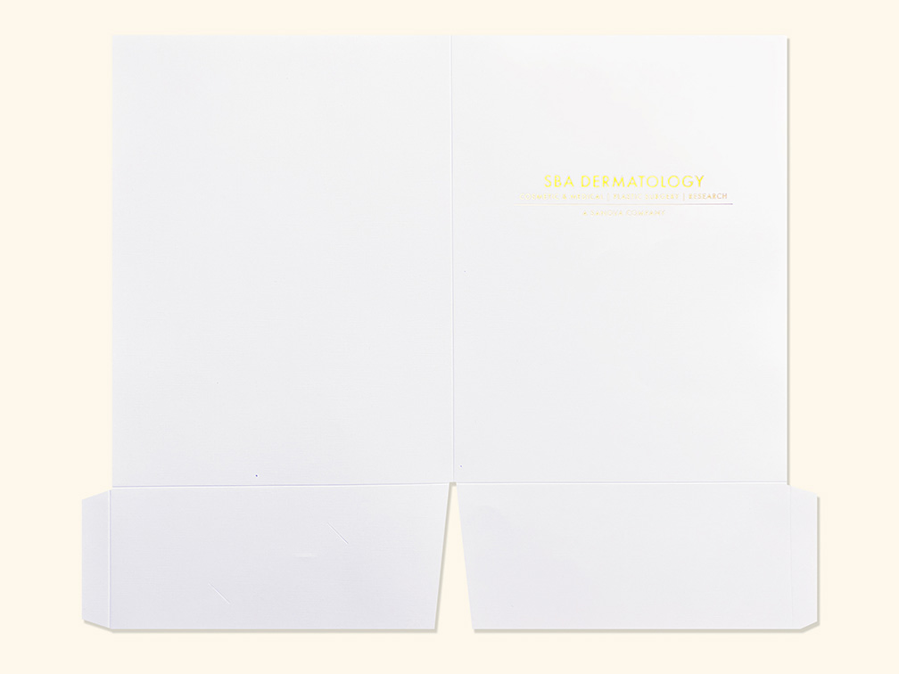 Images of unassembled folder sheet with gold foil