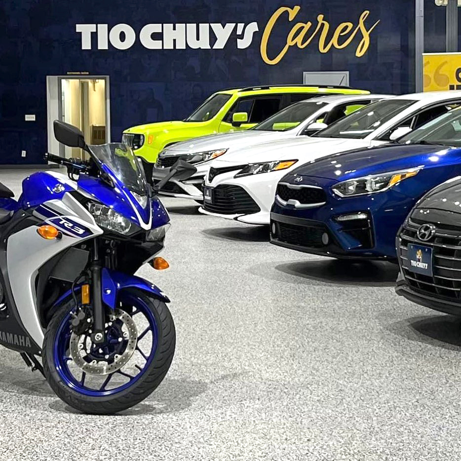 Photo showing Tio Chuy's showroom with motorcycles and cars